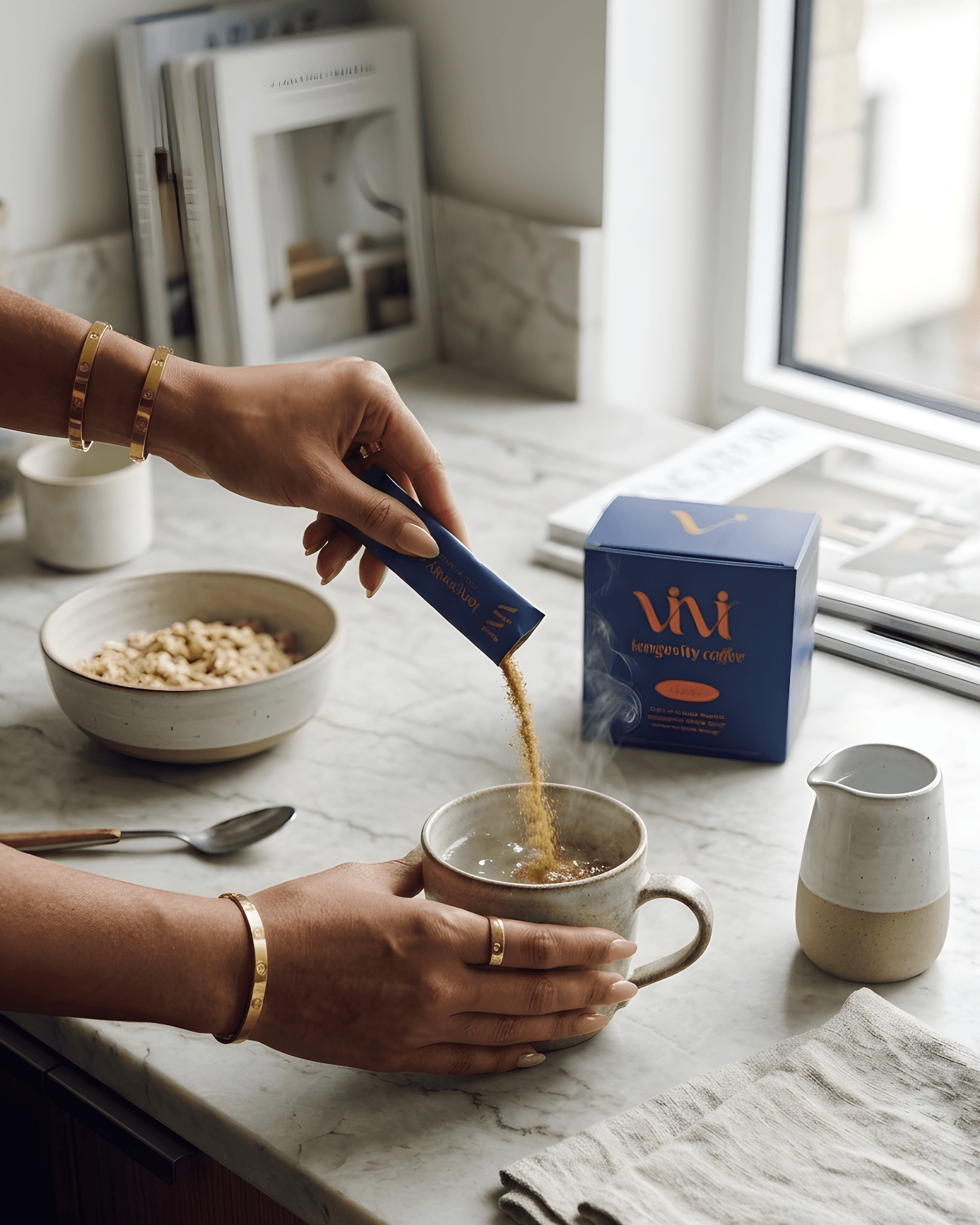 Person pouring coffee into a mug with a Viv coffee box on a kitchen counter.